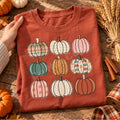 Rust Comfort Colors short sleeve tee with nine colorful patterned pumpkins