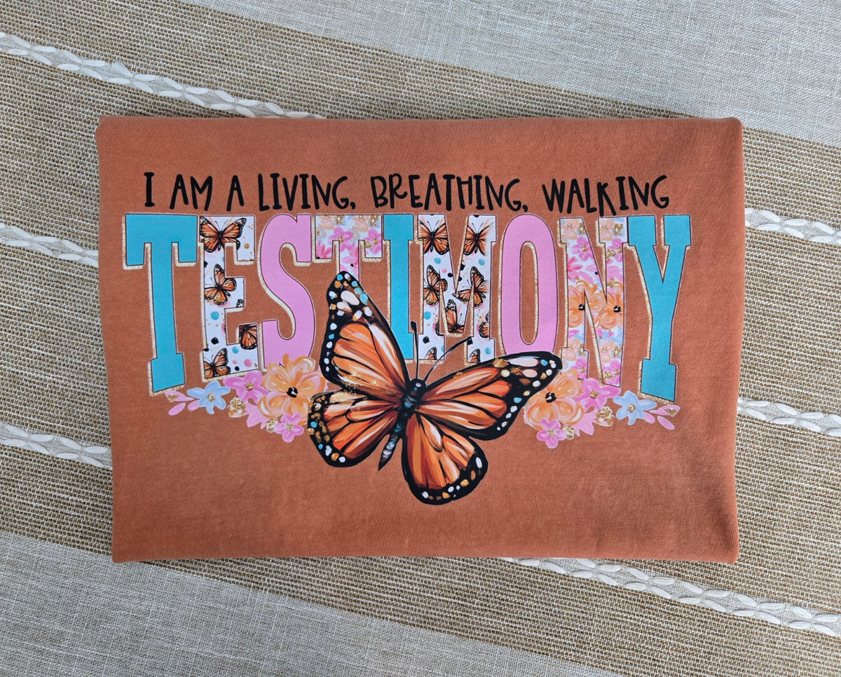 Comfort Colors short sleeve tee with colorful floral TESTIMONY lettering and monarch butterfly